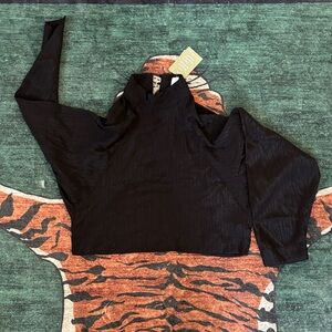 Black button neck bat-wing top